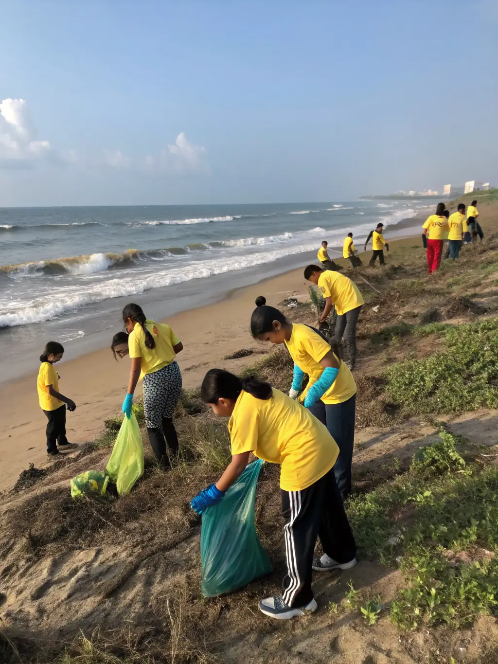 A group of children participating in a beach cleanup activity, collecting plastic waste and debris, with a park ranger supervising and providing guidance, set against the backdrop of the Cote Bleue coastline.